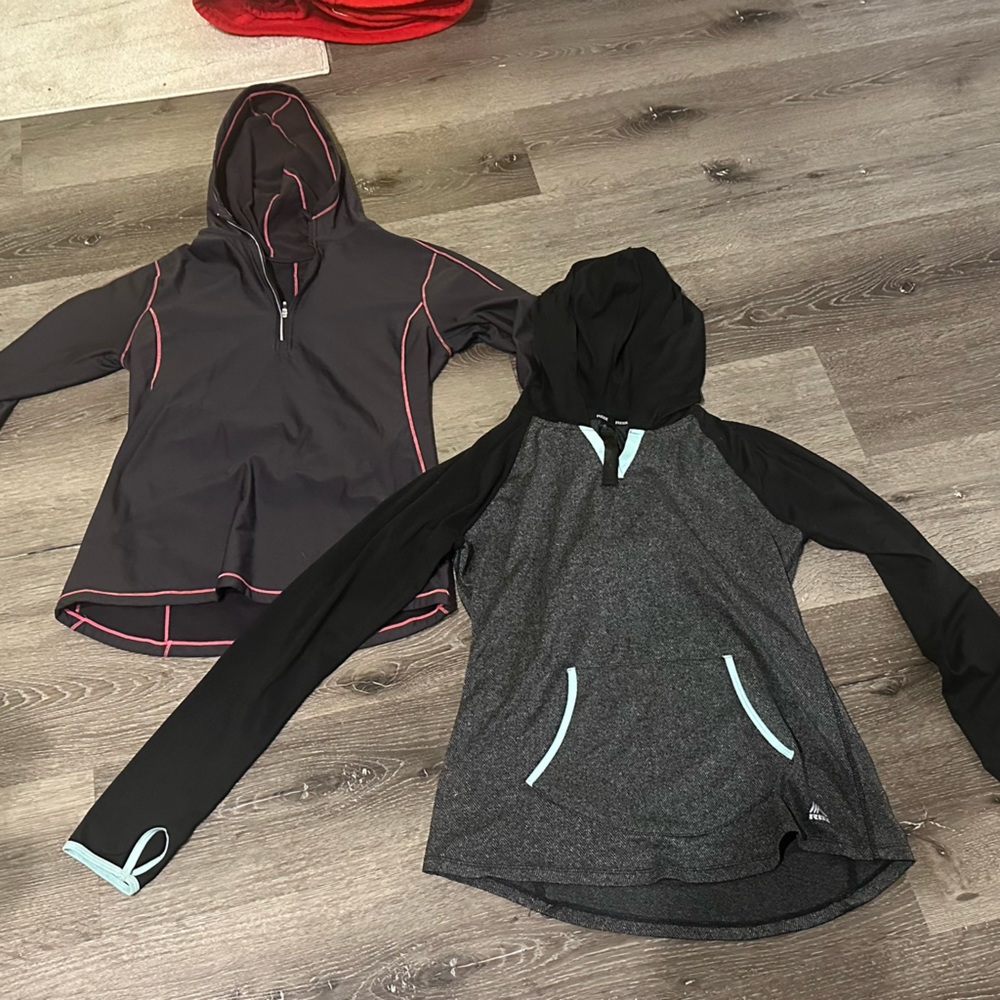 Two women size medium RBX althletic long sleeve tops